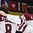 SPISSKA NOVA VES, SLOVAKIA - APRIL 21: Latvia's Andrejs Kostjuks #8 and Renars Karkls #3 look on during the national anthem after a 3-2 relegation round win over Belarus at the 2017 IIHF Ice Hockey U18 World Championship. (Photo by Andrea Cardin/HHOF-IIHF Images)

